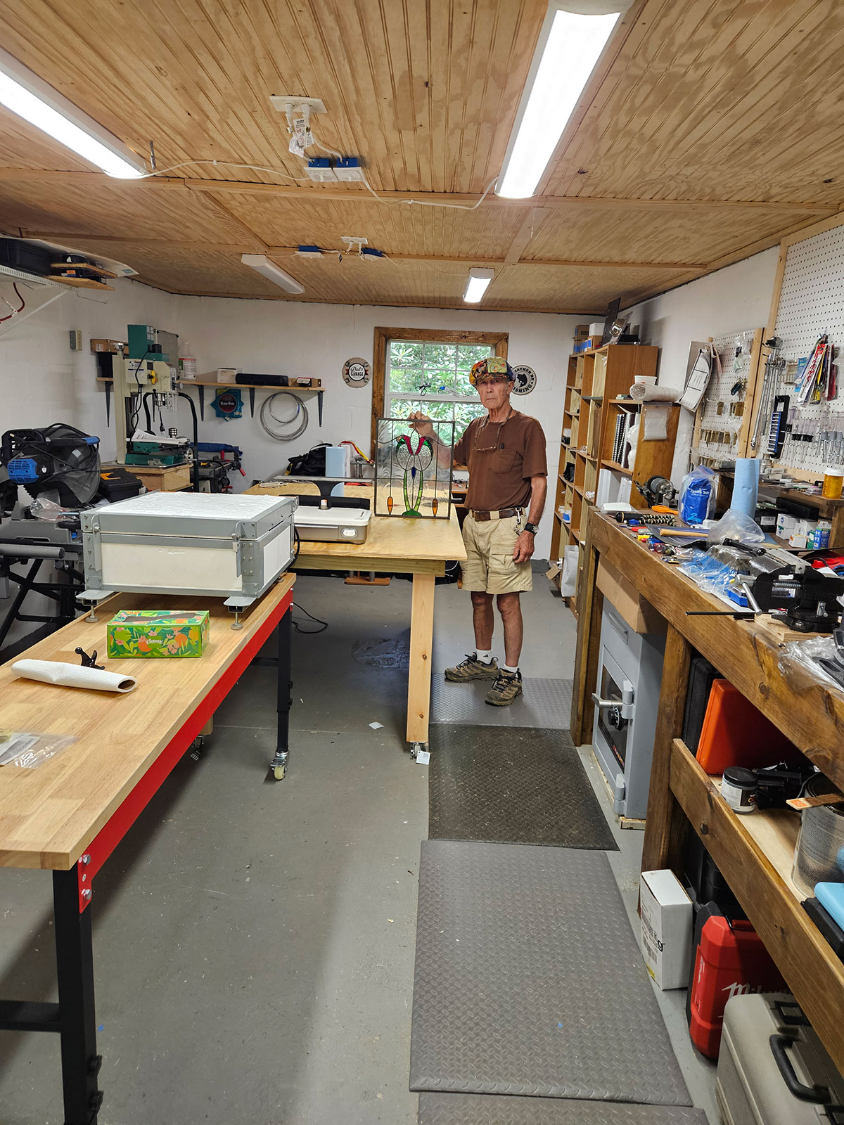 Dennis standing in his workshop
